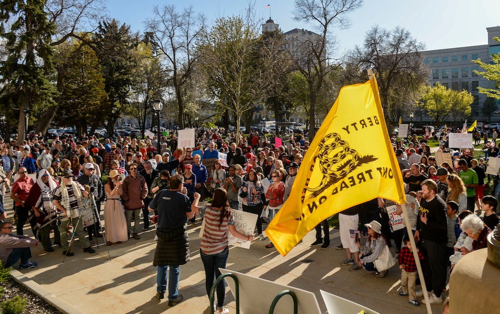 (Leah Hogsten | Tribune file photo) About 1,000 people defied COVID-19 restriction to protest them at Salt Lake City Hall on April 18. The same organizers plan a protest concert in Grantsville on Saturday, but a judge has issued a temporary restraining order against it.