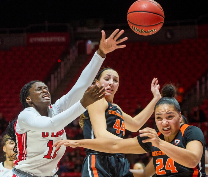 (Rick Egan  |  The Salt Lake Tribune)     Utah Utes forward Lola Pendande (12) goes for the ball along wroth Oregon State Beavers forward Taylor Jones (44) and Oregon State Beavers guard Destiny Slocum (24), in PAC-12 basketball action between the Utah Utes and the Oregon State Beavers at the Jon M. Huntsman Center, Saturday, Feb. 1, 2020.