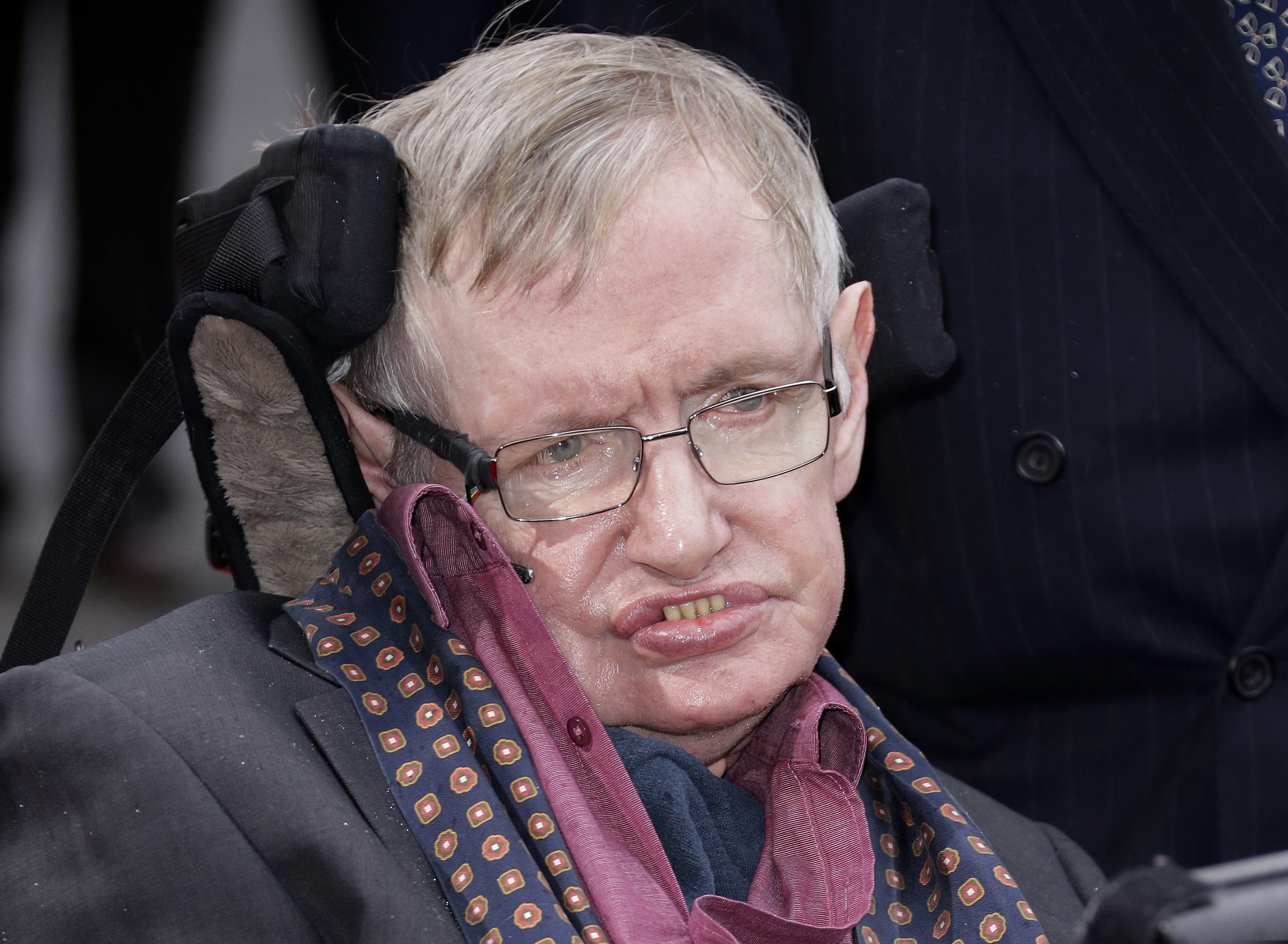 FILE - In this March 30, 2015, file photo, Professor Stephen Hawking arrives for the Interstellar Live show at the Royal Albert Hall in central London. Hawking, whose brilliant mind ranged across time and space though his body was paralyzed by disease, has died, a family spokesman said early Wednesday, March 14, 2018. (Photo by Joel Ryan/Invision/AP, File)