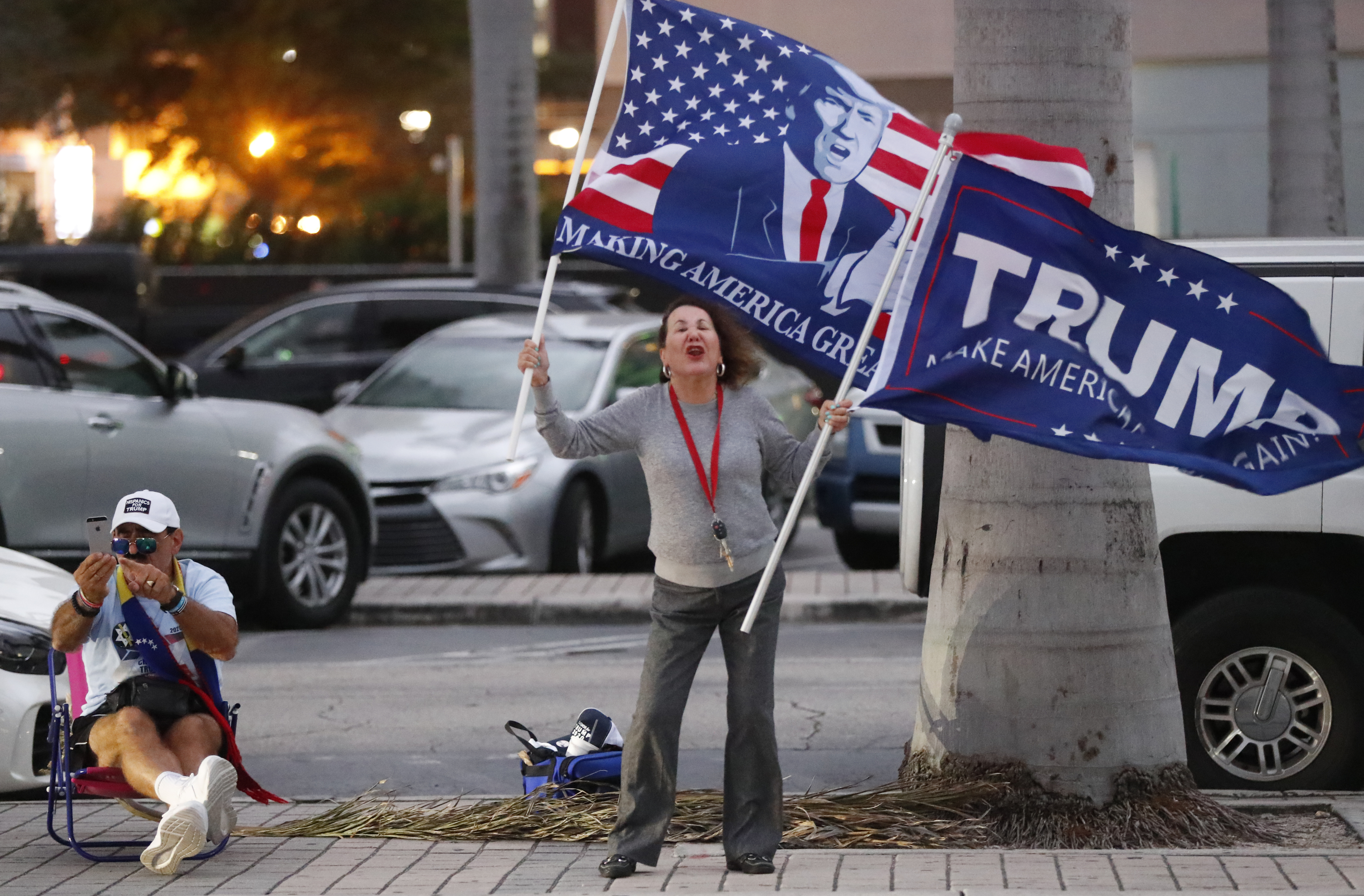 (Wilfredo Lee | AP) Trump supporters demonstrate across the street from an anti-war demonstration at the Torch of Friendship monument, Thursday, Jan. 9, 2020, in Miami.