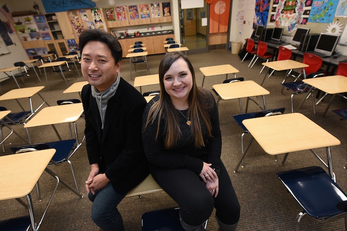 (Francisco Kjolseth  |  The Salt Lake Tribune)  Masa Fukuda, a songwriter, music arranger and director of the One Voice Children's Choir joins his wife Alyssa Fukuda in her classroom at Granger High School where she teaches Japanese. Set up by a friend in July of 2015, the two married a few months later in October. 
