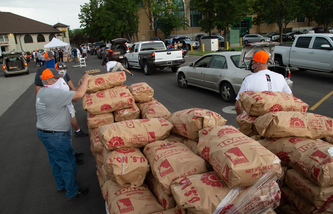 (Francisco Kjolseth  |  The Salt Lake Tribune) The third “Miracle Project” for the nonprofit foundation which raises money to purchase food produced by Utah farmers and then gives to residents in need, takes place at the Utah State Fairpark in Salt Lake City on Monday, July 27, 2020. The food donation from the Utah Farm Bureau’s “Farmers Feeding Utah” program provided food for 600 individuals and families who have recently become unemployed due to the coronavirus.