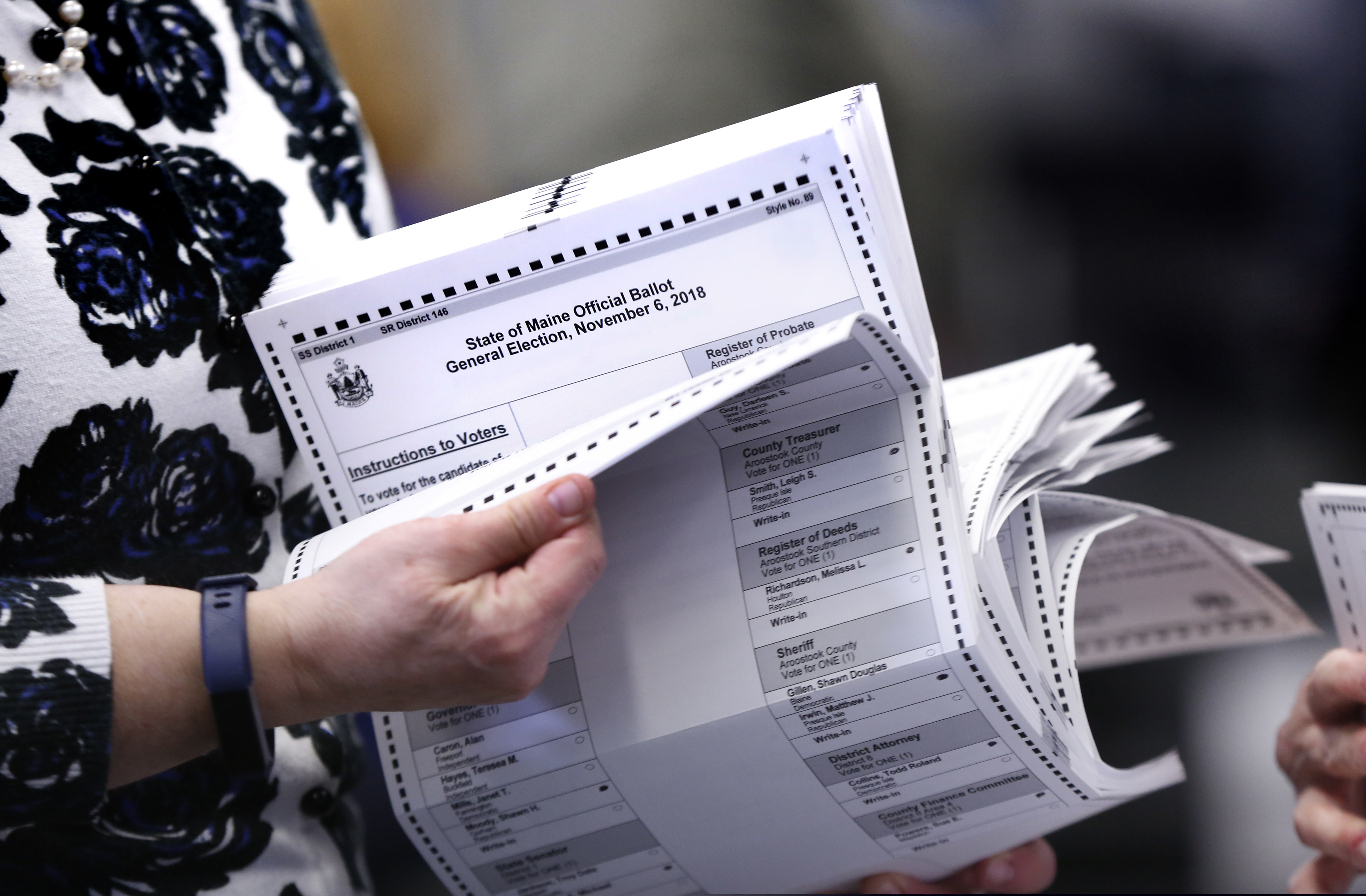 Ballots are prepared to be tabulated for Maine's Second Congressional District's House election Monday, Nov. 12, 2018, in Augusta, Maine. The election was the first congressional race in American history to be decided by the ranked-choice voting method that allows second choices. (AP Photo/Robert F. Bukaty)