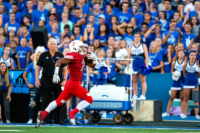 (Chris Detrick  |  The Salt Lake Tribune)  East's Sione Molisi (2) runs the ball during the game at Bingham High School Friday, August 25, 2017. Bingham is winning the game 24-17 at halftime. 