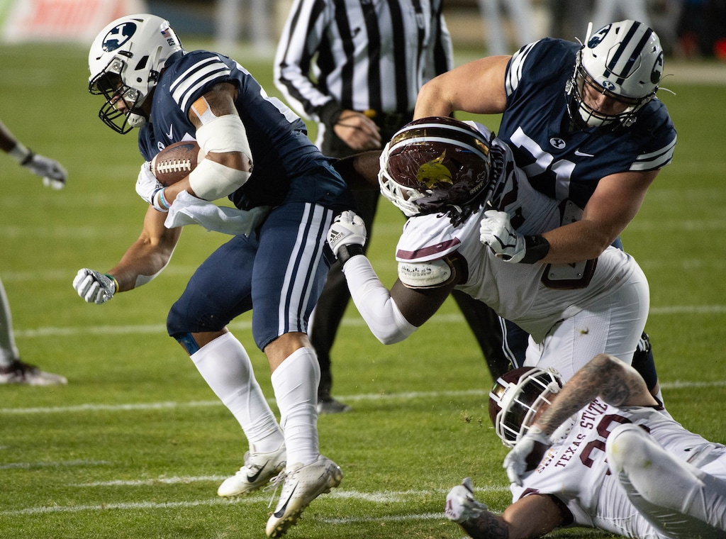 (Francisco Kjolseth  |  The Salt Lake Tribune) Brigham Young Cougars running back Tyler Allgeier (25) pushes past Texas State during an NCAA college football game at LaVell Edwards Stadium, Saturday, Oct. 24, 2020, in Provo, Utah.