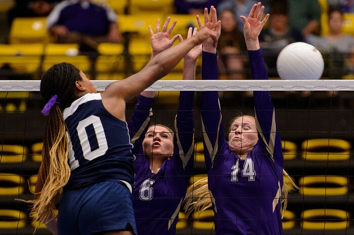 (Trent Nelson | The Salt Lake Tribune) Enterprise's Jaslyn Gardner hits toward North Summit's Hannah Lamon and Teesha Richins as Enterprise faces North Summit in the 2A State Volleyball Championship game in Orem, Saturday October 28, 2017.