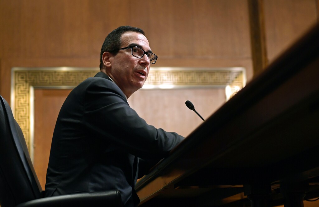 (Susan Walsh | The Associated Press)In this Feb. 14, 2018, photo, Treasury Secretary Steven Mnuchin testifies before the Senate Finance Committee on Capitol Hill in Washington. The Trump administration on Thursday imposed sanctions on 19 Russians for alleged interference in the 2016 U.S. presidential election, including 13 indicted by special counsel Robert Mueller as part of his Russia-related investigation.  The Treasury Department announced the sanctions amid withering criticism of Trump and his administration for failing to use the congressionally mandated authority to punish Russia for the election interference. Trump himself has been skeptical of the allegations.