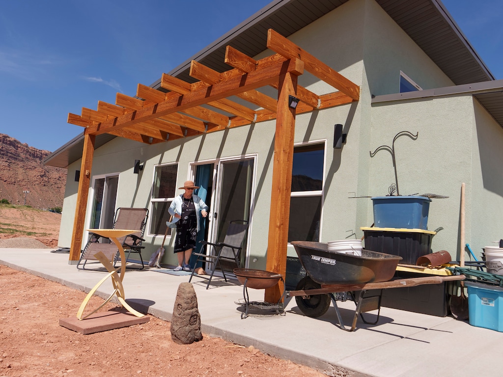 (Leah Hogsten | The Salt Lake Tribune) Arroyo Crossing homeowner and artist Kari Taylor Schreck got to pick out many of features of the home she shares with her husband, including the color, May 16, 2023. The Arroyo Crossing housing development, built on acreage owned by the Moab Area Community Land Trust, provides permanent affordable housing to Moab's working families and individuals who could not otherwise afford a home.