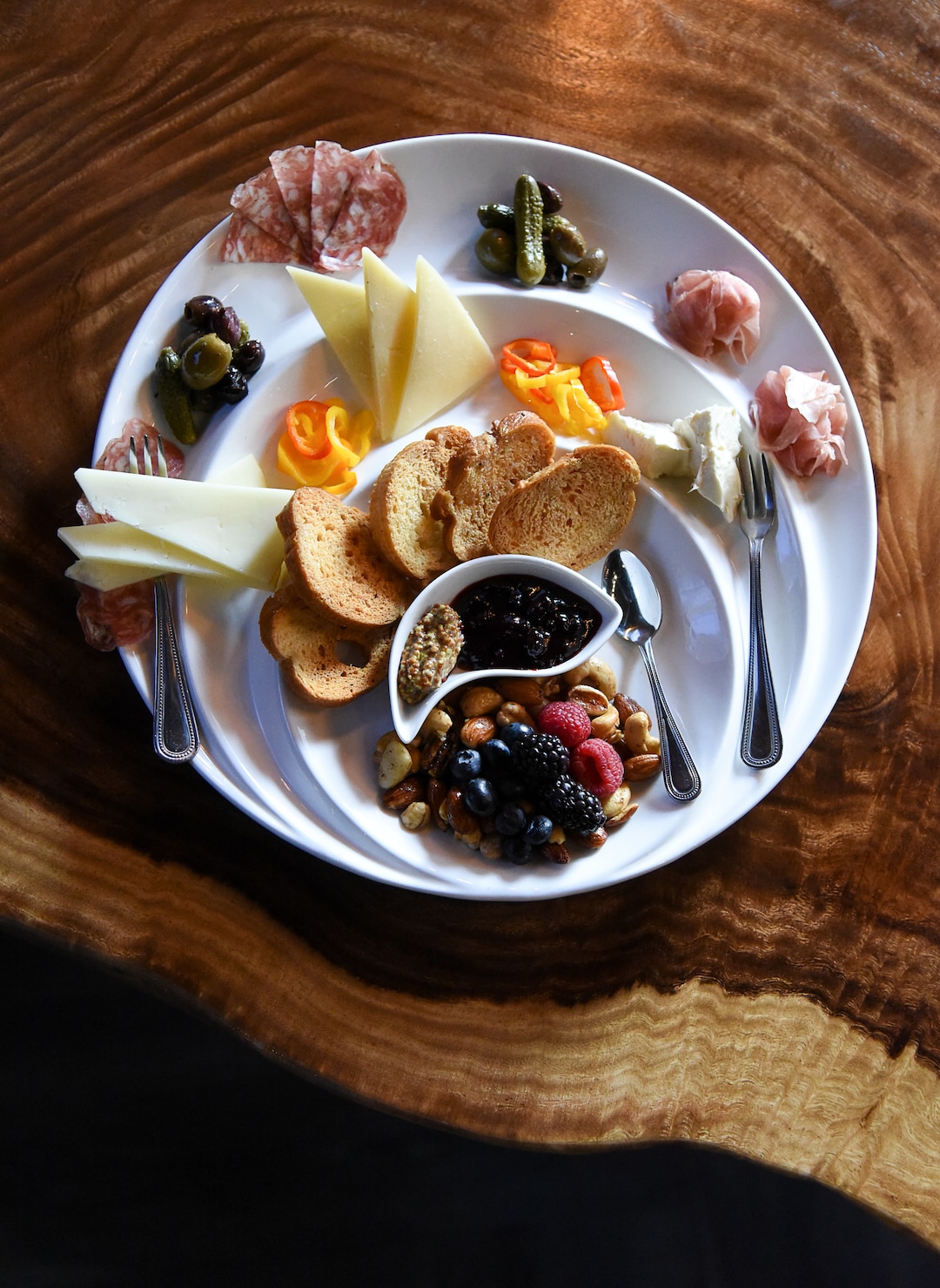 (Francisco Kjolseth  |  The Salt Lake Tribune)  La Charcuterie with a daily selection of local cheeses, fresh fruit, Mediterranean olives, pickles, baby peppers, house nuts, grain mustard, huckleberry serrano jam and grilled baguette at the new London Belle Supper Club, a new Salt Lake City bar named after Belle London, a famous Utah madam, at 321 S. Main.