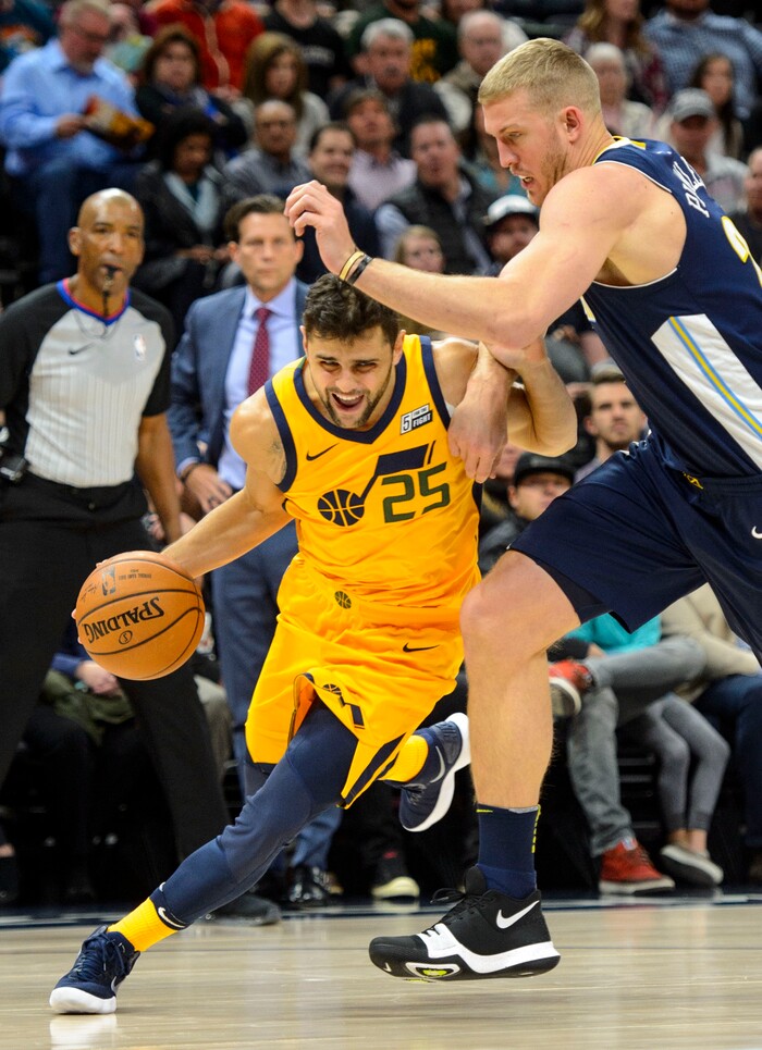 (Steve Griffin  |  The Salt Lake Tribune) Utah Jazz guard Raul Neto (25) drives past Denver Nuggets center Mason Plumlee (24) during the Utah Jazz versus Denver Nuggets NBA basketball game at Vivint Smart Home Arena  in Salt Lake City Tuesday November 28, 2017.