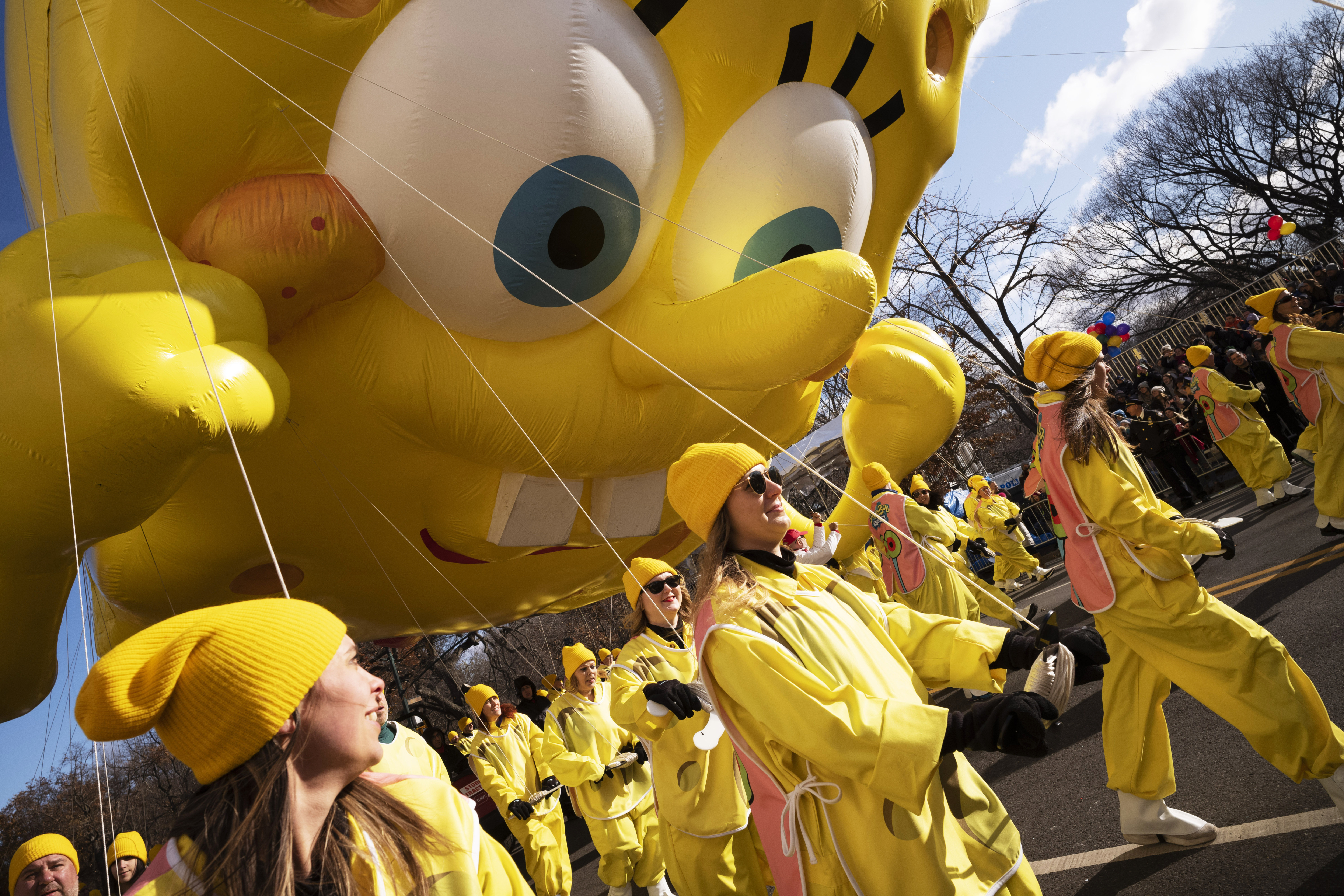 (Mark Lennihan | AP)  Balloon handlers hold SpongeBob Square Pants balloon close to the ground as strong winds affect the Macy's Thanksgiving Day Parade, Thursday, Nov. 28, 2019, in New York.