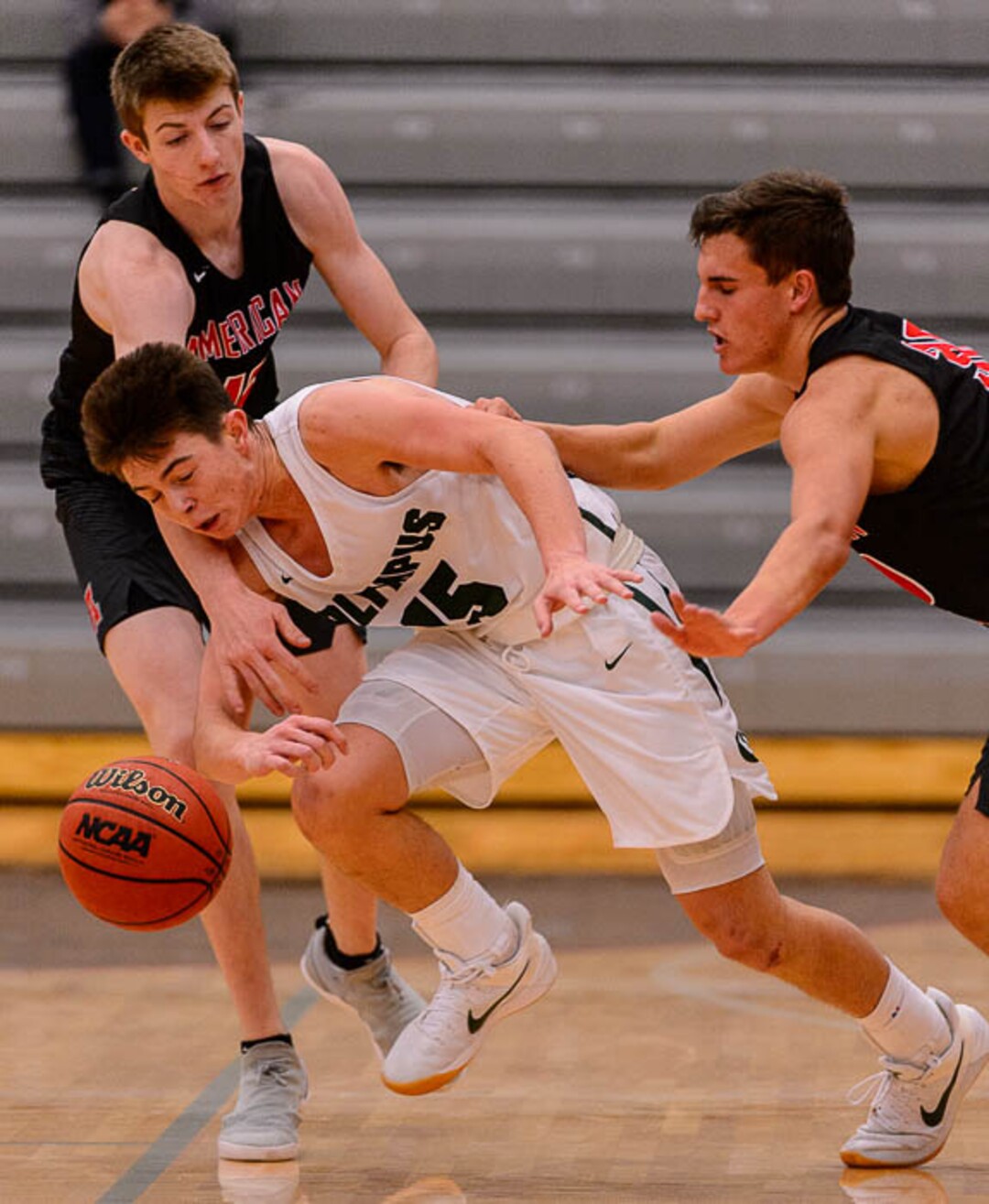 (Trent Nelson | The Salt Lake Tribune)  Olympus's Rylan Jones is double-teamed as American Fork hosts Olympus in the Utah Elite Eight tournament, Saturday December 9, 2017.