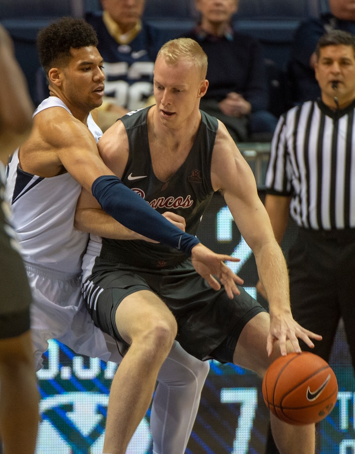 (Rick Egan  |  The Salt Lake Tribune)       BSanta Clara Broncos forward Henrik Jadersten (3) tries to work the ball inside, as Brigham Young Cougars forward Yoeli Childs (23) defends, in basketball action between Brigham Young Cougars and Santa Clara Broncos at the Marriott Center in Provo, Saturday, Jan. 12, 2019.


