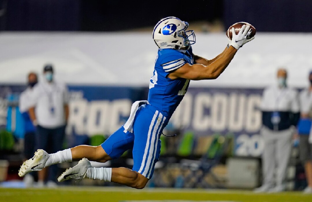 BYU wide receiver Gunner Romney makes a catch during the first half of the team's NCAA college football game against Troy on Saturday, Sept. 26, 2020, in Provo, Utah. (AP Photo/Rick Bowmer, Pool)