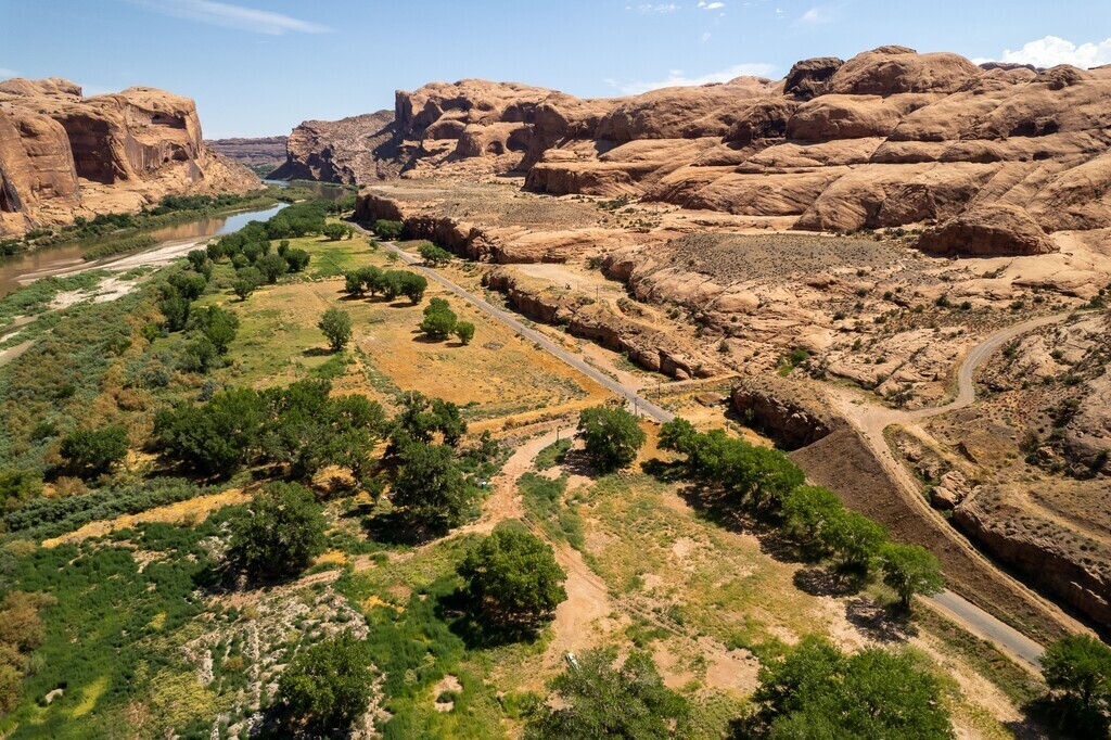 (Trent Nelson | The Salt Lake Tribune) An aerial view shows the Echo Canyon development site along the Colorado River southwest of Moab in 2023. Two advocacy groups filed a lawsuit on Feb. 10, challenging the project’s preliminary municipality certification and the state law that enabled it.