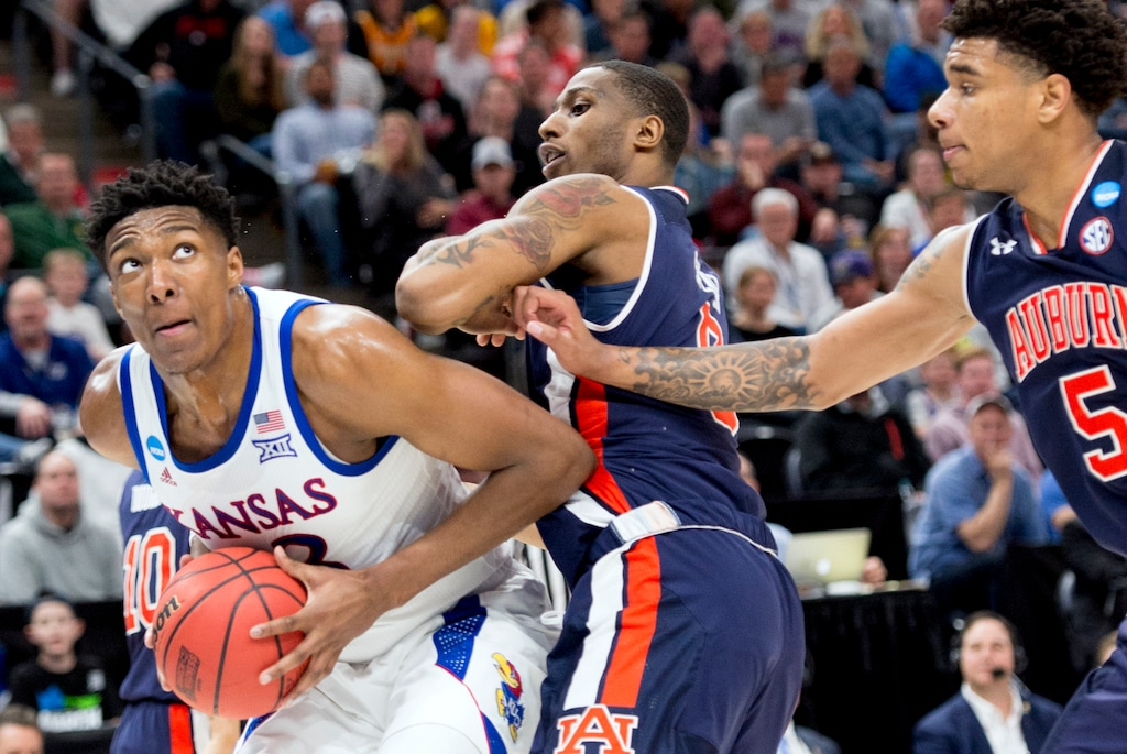 (Leah Hogsten | The Salt Lake Tribune) Kansas Jayhawks forward David McCormack (33) tries to get to the basket under pressure from Auburn Tigers forward Horace Spencer (0) and Auburn Tigers forward Chuma Okeke (5) as Auburn faces Kansas in the second round of the NCAA tournament in Salt Lake City on Saturday, March 23, 2019.