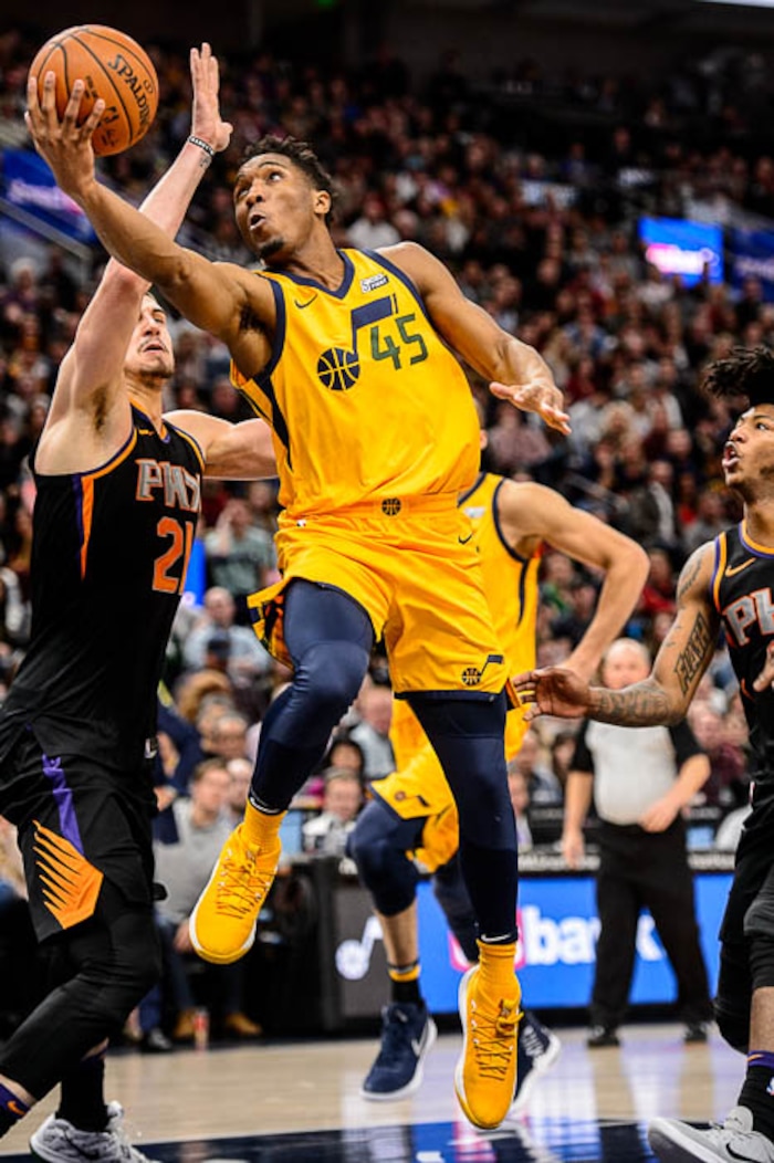 (Trent Nelson | The Salt Lake Tribune)  Utah Jazz guard Donovan Mitchell (45) shoots as the Utah Jazz host the Phoenix Suns, NBA basketball in Salt Lake City, Wednesday Feb. 14, 2018.