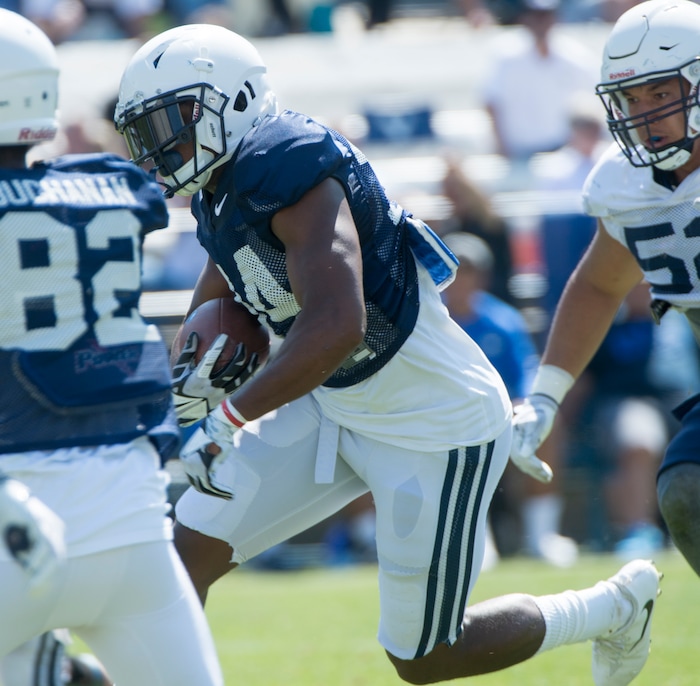 (Rick Egan  |  The Salt Lake Tribune)  Runningback Riley Burt runs the ball, during  a BYU public scrimmage at Lavell Edwards Stadium, Thursday, August 17, 2017.