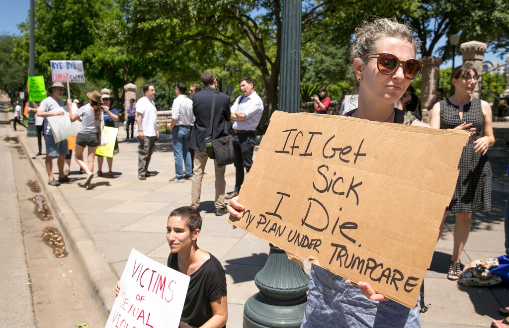 (Jay Janner/Austin American-Statesman via AP) In this Friday May 5, 2017 file photo, Sophia Donnelly joins others to protest the U.S. House passage of a bill to repeal and replace the Affordable Care Act, at the south gate of the Capitol in Austin, Texas. On Friday, Republican Gov. Greg Abbott spokesman John Wittman said, "Congress’ efforts to repeal and replace Obamacare is a step toward ending the lawless health care regime that failed to live up to its promises and is spiraling to a hasty death."