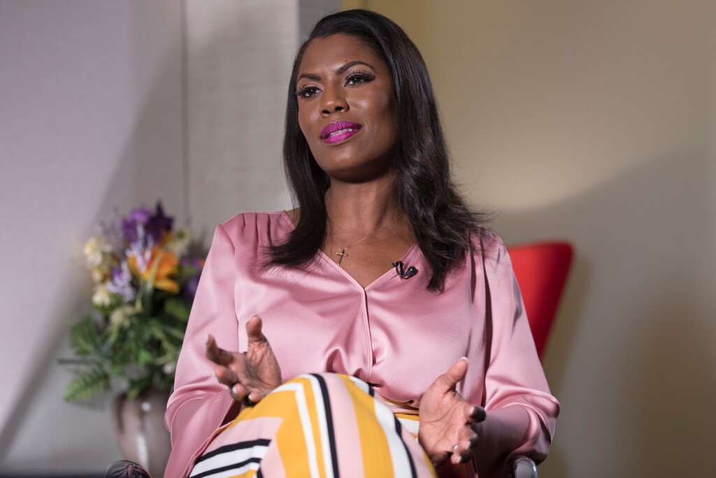 Former White House staffer Omarosa Manigault Newman speaks during an interview with The Associated Press, Tuesday, Aug. 14, 2018, in New York. Manigault Newman declared she “will not be silenced” by President Donald Trump, remaining defiant as her public feud with her former boss shifted from a war of words to a possible legal battle. (AP Photo/Mary Altaffer)