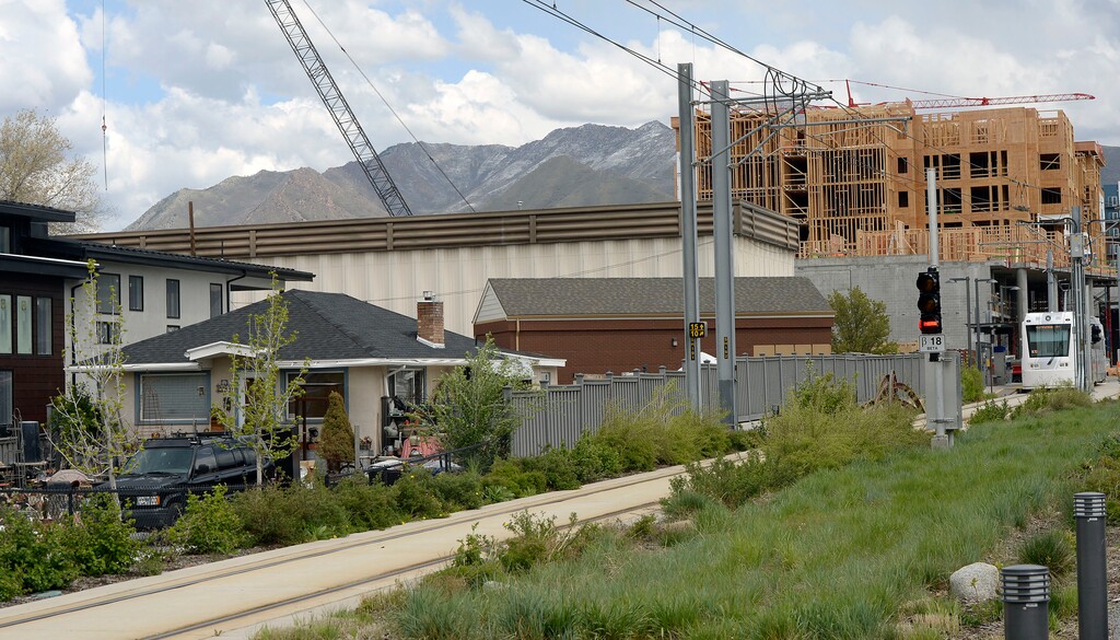 (Al Hartmann  |  The Salt Lake Tribune) 	Mixed use development along Sugarmont Ave. and 1000 E. in Sugarhouse.  Sugarhouse Trolley, right, runs west towards State Street Tuesday May 1, 2018.   A Housing Gap Coalition formed by the Salt Lake Chamber of Commertce is going to encourage local government officials to adopt more flexible zoning policies and to cut regulatory fees to stimulate the development of more types of housing, particularly units affordable for lower income people, in all parts of the Salt Lake Valley.  The goal is to get more mixes of housing — high density, high rise apartments next to single family homes alongside smaller apartment buildings with some businesses too. 