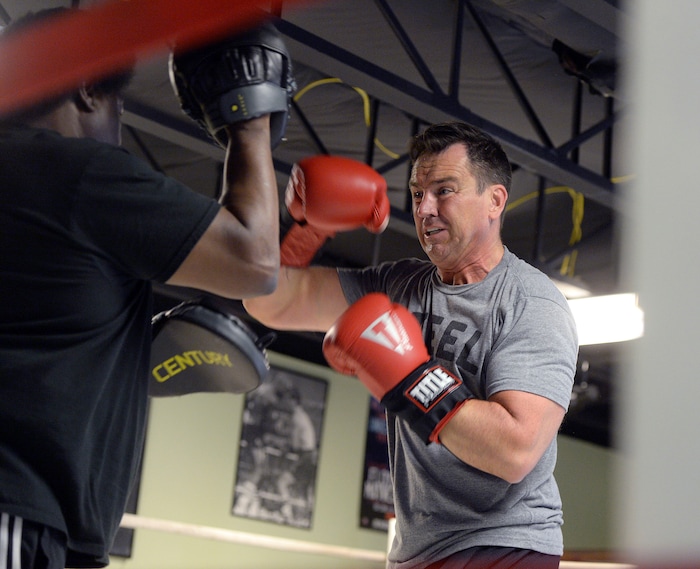(Al Hartmann | The Salt Lake Tribune)
House Speaker Greg Hughes spars with Eddie "Flash" Newman during his workout at the Flash Academy gym in Holladay Tuesday August 29. He's among a handful of local politicians, police and lobbyists who will box in a series of charity matches to benefit a national group that works to end domestic violence.