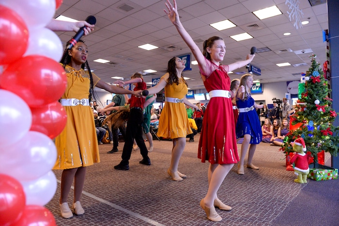 (Leah Hogsten | The Salt Lake Tribune) Clayton Production team dancers entertain the Gold Star families on Saturday. Ten Gold Star families from Salt Lake City were treated to a Winter Wonderland scene, including Whoville and the Grinch at their boarding gate at Salt Lake International Airport, Dec. 7, 2019 before their flight to Disney World aboard the Snowball Express. This month, the Gary Sinise Foundation's Snowball Express will fly more than 1,700 family members of fallen U.S. military heroes to Disney World for a holiday retreat.
