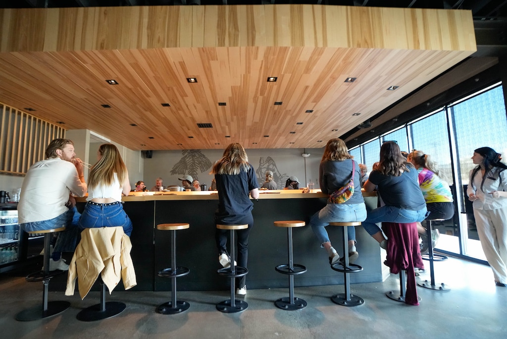 (Francisco Kjolseth | The Salt Lake Tribune) People enjoy the simple setting consisting of a single semicircular bar at Momomaru, a new restaurant in Salt Lake City started by chef Eric Park, that specializes in hand rolls made only with rice, seaweed and fish, Thursday, March 26, 2026.