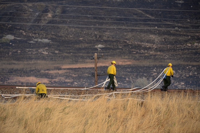 (Francisco Kjolseth  |  The Salt Lake Tribune)  Crews battle a grass fire in Tooele county being dubbed the Green Ravine fire as it burns on Tuesday, Sept. 3, 2019.