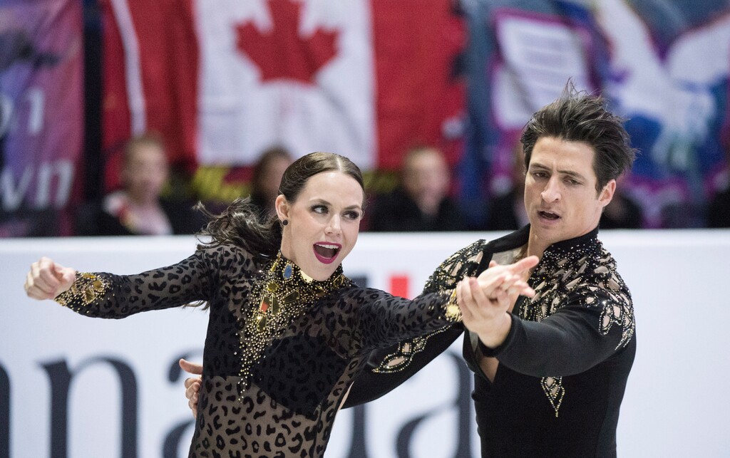 Canada's Tessa Virtue and Scott Moir perform their short dance in the ice dance competition at Skate Canada International, Friday, Oct. 27, 2017 in Regina, Saskatchewan. (Paul Chiasson/The Canadian Press via AP)
