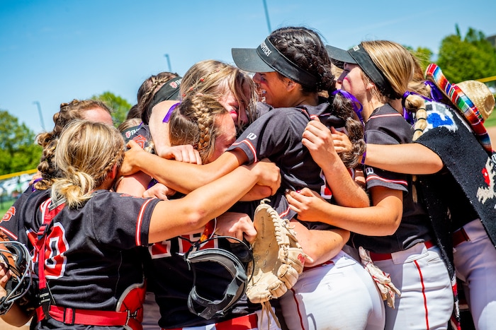 (Isaac Hale | Special to The Tribune) Spanish Fork players embrace after the Spanish Fork Lady Dons defeated the Mountain Ridge Sentinels in a best-of-three series to win the 5A state softball championship at the Spanish Fork Sports Park on Friday, May 28, 2021.