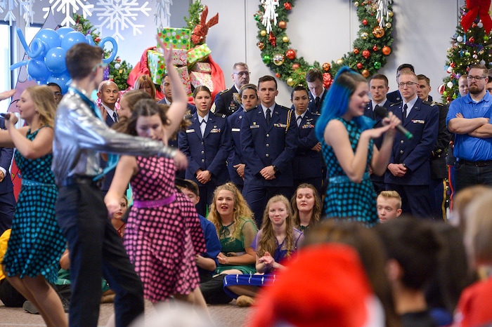 (Leah Hogsten | The Salt Lake Tribune) Clayton Production team dancers entertain the Gold Star families on Saturday. Ten Gold Star families from Salt Lake City were treated to a Winter Wonderland scene, including Whoville and the Grinch at their boarding gate at Salt Lake International Airport, Dec. 7, 2019 before their flight to Disney World aboard the Snowball Express. This month, the Gary Sinise Foundation's Snowball Express will fly more than 1,700 family members of fallen U.S. military heroes to Disney World for a holiday retreat.