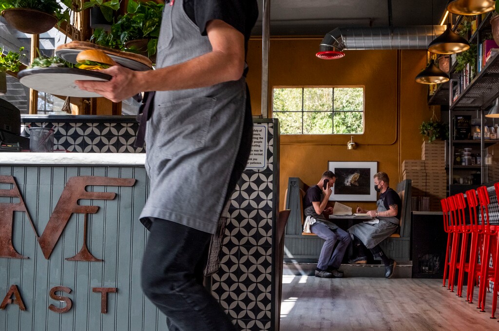 (Leah Hogsten  |  The Salt Lake Tribune)  Nomad East's chefs and owners Vance Lott and Justin Soelberg, at right. Nomad East is Nomad Eatery's second location, offering modern American cuisine, Sept. 15, 2020. All of the cooking is done in two large wood-fired pizza ovens. This weekend it also will begin offering Sunday brunch.