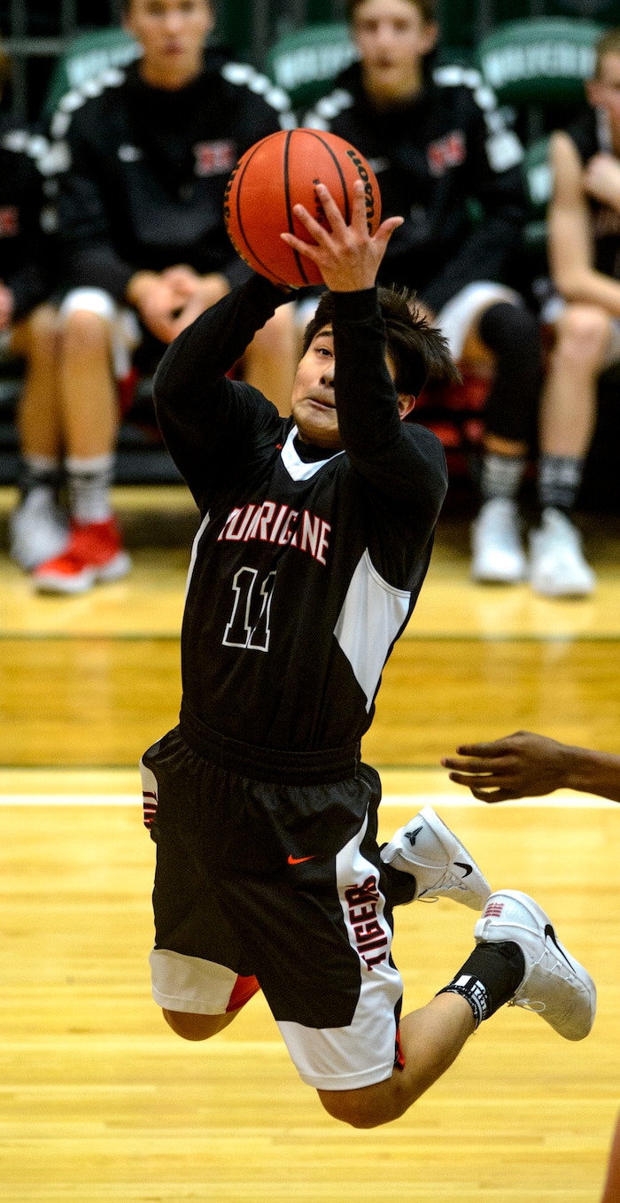 (Steve Griffin | The Salt Lake Tribune) Hurricane's J.J. Gonzales (11) rips down a rebound during 4A basketball playoff game against Juan Diego at the Utah Valley UniversityÕs UCCU Center in Provo Thursday March 1, 2018.
