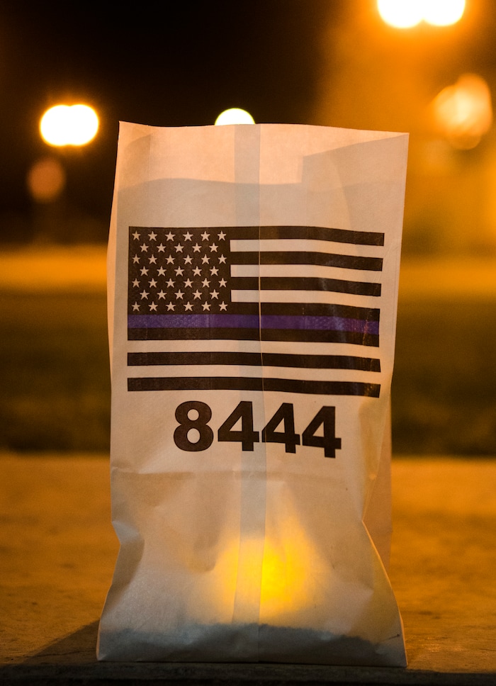 (Rick Egan  |  The Salt Lake Tribune)  A candle burns in remembrance of  West Valley City Officer Cody Brotherson, during a memorial ceremony at Fairbourne Station Plaza in West Valley City, in remembrance of Cody Brotherson, who was killed in the line of duty one year ago today.  Monday, November 6, 2017.
