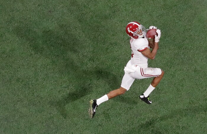 Alabama's DeVonta Smith catches a touchdown pass during overtime of the NCAA college football playoff championship game against Georgia Monday, Jan. 8, 2018, in Atlanta. Alabama won 26-23. (AP Photo/John Bazemore)