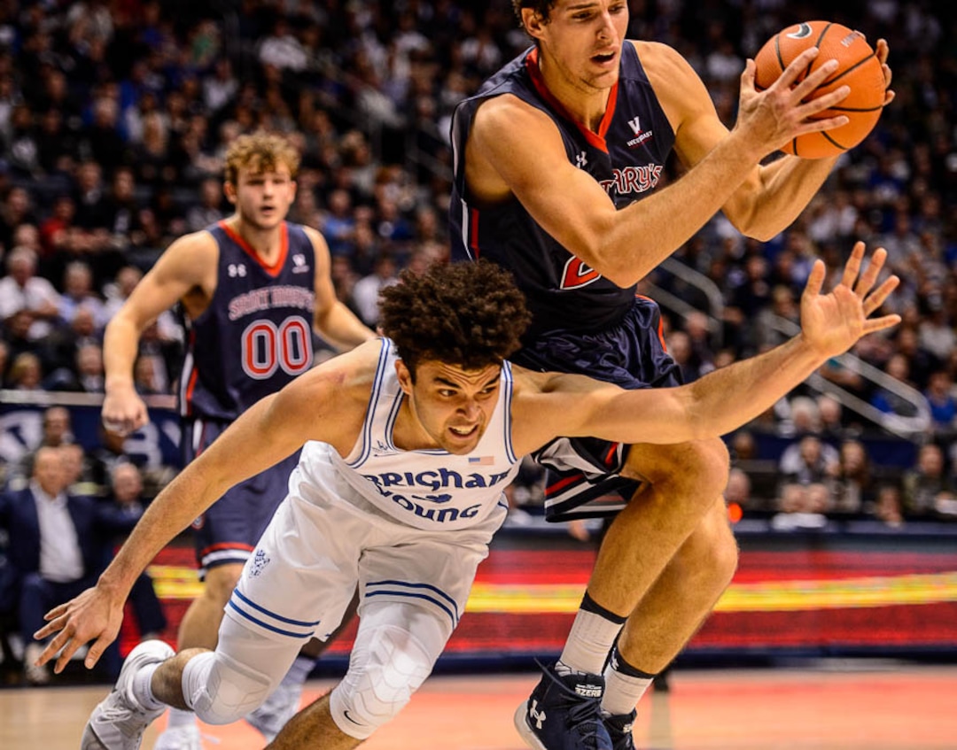(Trent Nelson | The Salt Lake Tribune)   Brigham Young Cougars guard Elijah Bryant (3) loses the ball to St. Mary's Gaels center Evan Fitzner (21) in overtime as BYU hosts the St. Mary's Gaels, NCAA basketball in Provo, Saturday December 30, 2017.