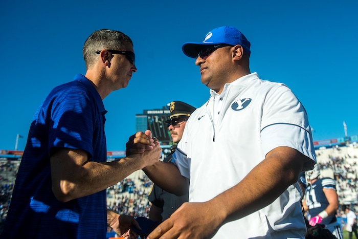 (Chris Detrick  |  The Salt Lake Tribune)  Brigham Young Cougars head coach Kalani Sitake and San Jose State Spartans embrace after the game at LaVell Edwards Stadium Saturday, October 28, 2017.  Brigham Young Cougars defeated San Jose State Spartan 41-20.