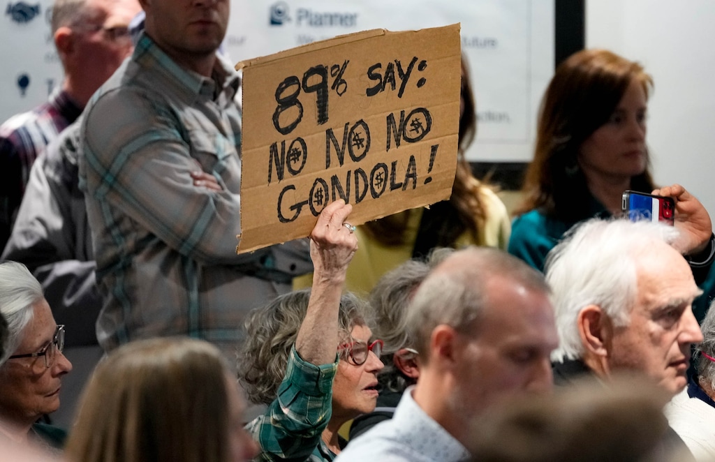 (Francisco Kjolseth | The Salt Lake Tribune) Sandra Reus of Sandy expresser her opposition to a gondola as people pack the room during the Wasatch Front Regional Council meeting at The Gateway in Salt Lake City on Thursday, Jan. 26, 2023. The council considered publishing a draft of the Regional Transportation Plan, which would include the proposed Little Cottonwood Canyon gondola.