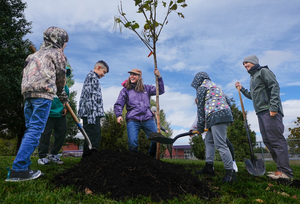 (Francisco Kjolseth | The Salt Lake Tribune) Salt Lake City Mayor Erin Mendenhall, center, is joined by the city’s urban forestry team and third graders from Meadowlark Elementary to plant the 1,000th west-side tree of the year on Wednesday, Oct. 26, 2022.