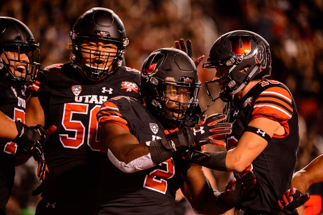(Trent Nelson | The Salt Lake Tribune)  Utah Utes running back Zack Moss (2) celebrates a touchdown as the University of Utah hosts Washington at Rice-Eccles Stadium in Salt Lake City, Saturday Sept. 15, 2018.