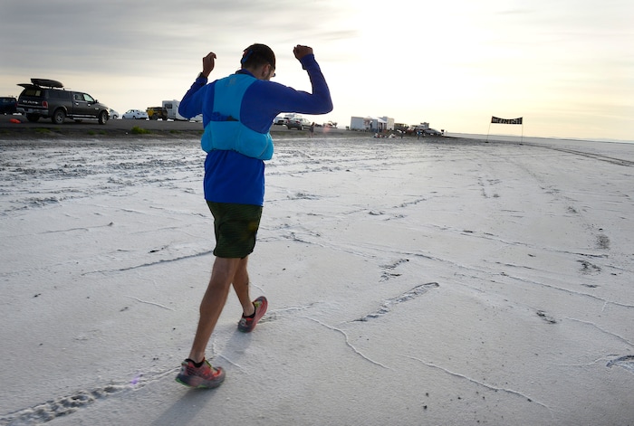 (Scott Sommerdorf | The Salt Lake Tribune)
Alex Doolan celebrates as he approaches the finish line the Salt Flats 100 Endurance Run, Saturday, May 5, 2018. Doolan finished in 8th place.
