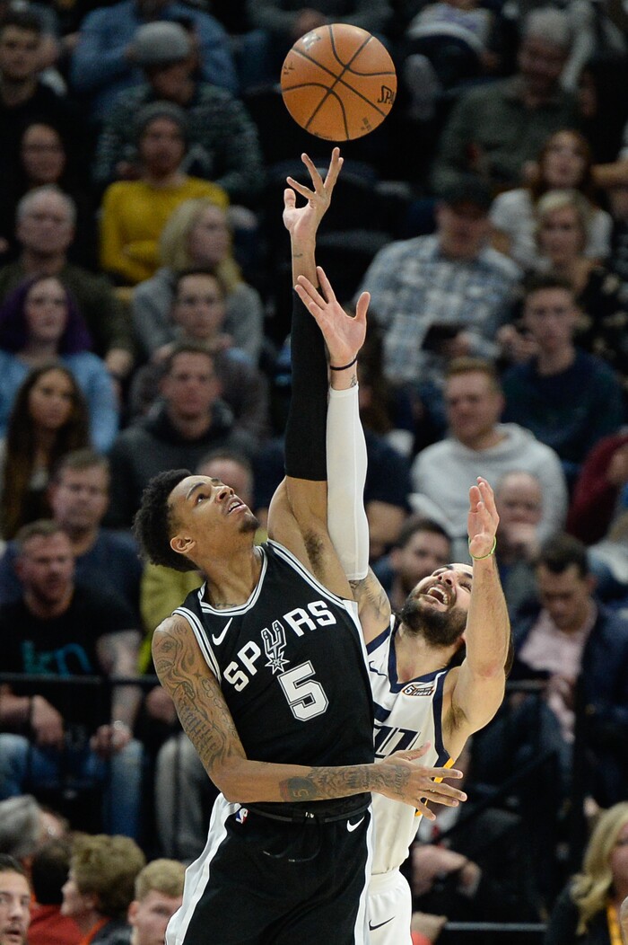 (Francisco Kjolseth  |  The Salt Lake Tribune)  San Antonio Spurs guard Dejounte Murray (5) battles for a ball with Utah Jazz guard Ricky Rubio (3) during the second half of the NBA basketball game in Salt Lake City, Thursday, Dec. 21, 2017.