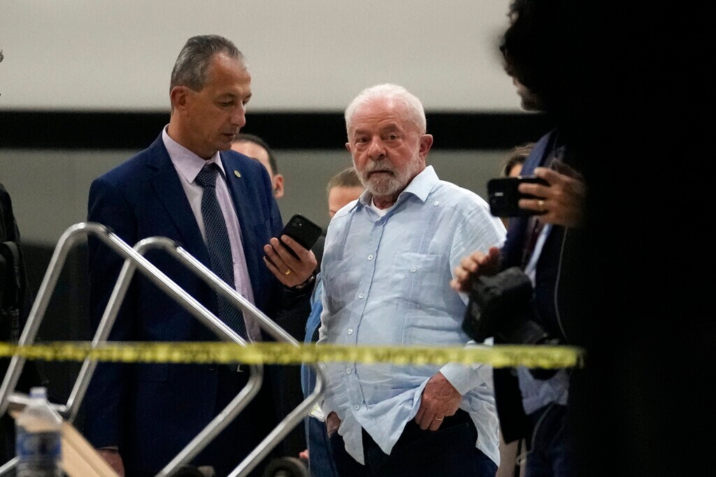 (Eraldo Peres | AP) Brazil's President Luiz Inacio Lula da Silva walks in Planalto Palace after it was stormed by supporters of Brazil's former President Jair Bolsonaro in Brasilia, Brazil, Sunday, Jan. 8, 2023.