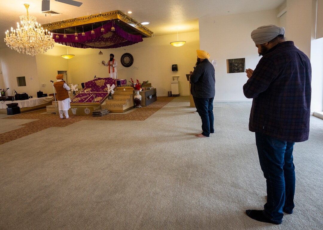 (Rick Egan | The Salt Lake Tribune) Bachider Singh and  Kuljeat Singh bless wool blankets that members of the Sikh community are donating to help the unsheltered stay warm during a blessing ceremony at the Sikh temple in Taylorsville, on Thursday, Dec. 23, 2021.