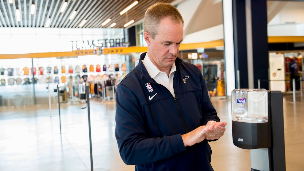 (Jeremy Harmon  |  The Salt Lake Tribune) Frank Zang, Vice President of Communications at Larry H. Miller Group, washes his hands at a hand sanitizer station at Vivint Smart Home Arena ahead of a game between the Jazz and the Raptors on Monday, March 9, 2020.