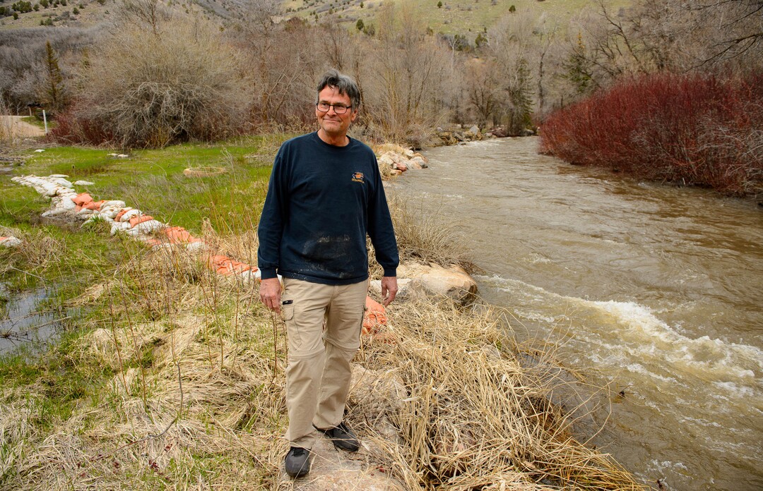 (Trent Nelson  |  The Salt Lake Tribune)  Wayne Hill stands near sandbags put down two years before, when the South Fork Ogden River threatened to flood homes. Hill is preparing for possible flooding at his home on the banks of the South Fork Ogden River east of Huntsville on Monday April 22, 2019.