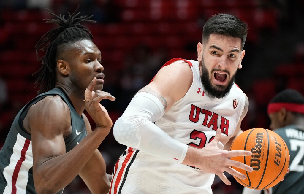 (Francisco Kjolseth | The Salt Lake Tribune) Washington State Cougars forward Efe Abogidi (0) pressures Utah Utes forward Dusan Mahorcic (21) in game action during an NCAA college basketball game at the Jon M.Huntsman Center, on Saturday, Jan. 8, 2022. Utah lost 61-77.