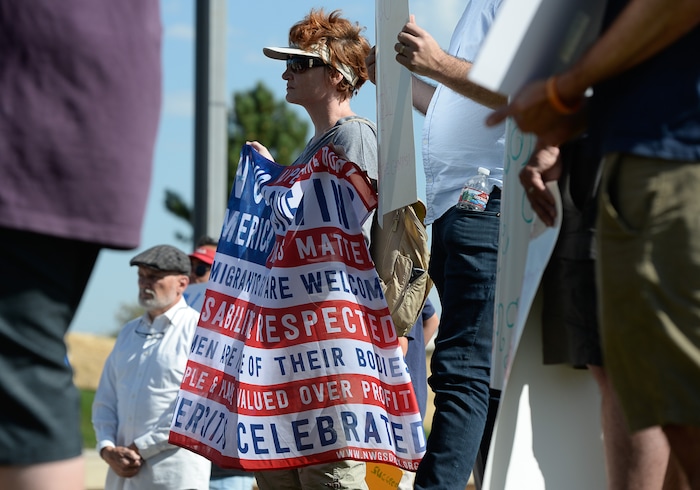 (Francisco Kjolseth  |  The Salt Lake Tribune)  Kathleen Koprowski shows her support for the immigrant community as she joins a rally organized by Utah Jewish Community organizations gathered outside of the U.S. Immigration and Customs Enforcement (ICE) field office at 2975 S. Decker Lake Drive, West Valley City, on Saturday, Aug. 10, 2019, for a Close The Camps vigil.