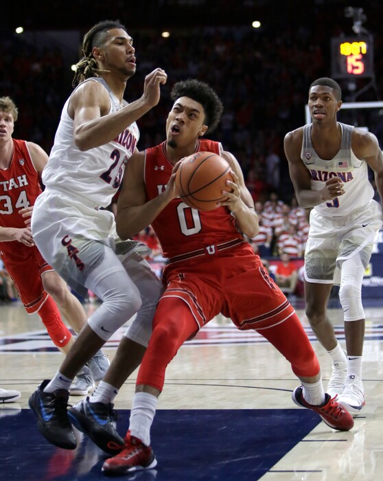 (Rick Scuteri | The Associated Press) Utah guard Sedrick Barefield (0) drives against Arizona forward Keanu Pinder in the first half during an NCAA college basketball game, Saturday, Jan. 27, 2018, in Tucson, Ariz.